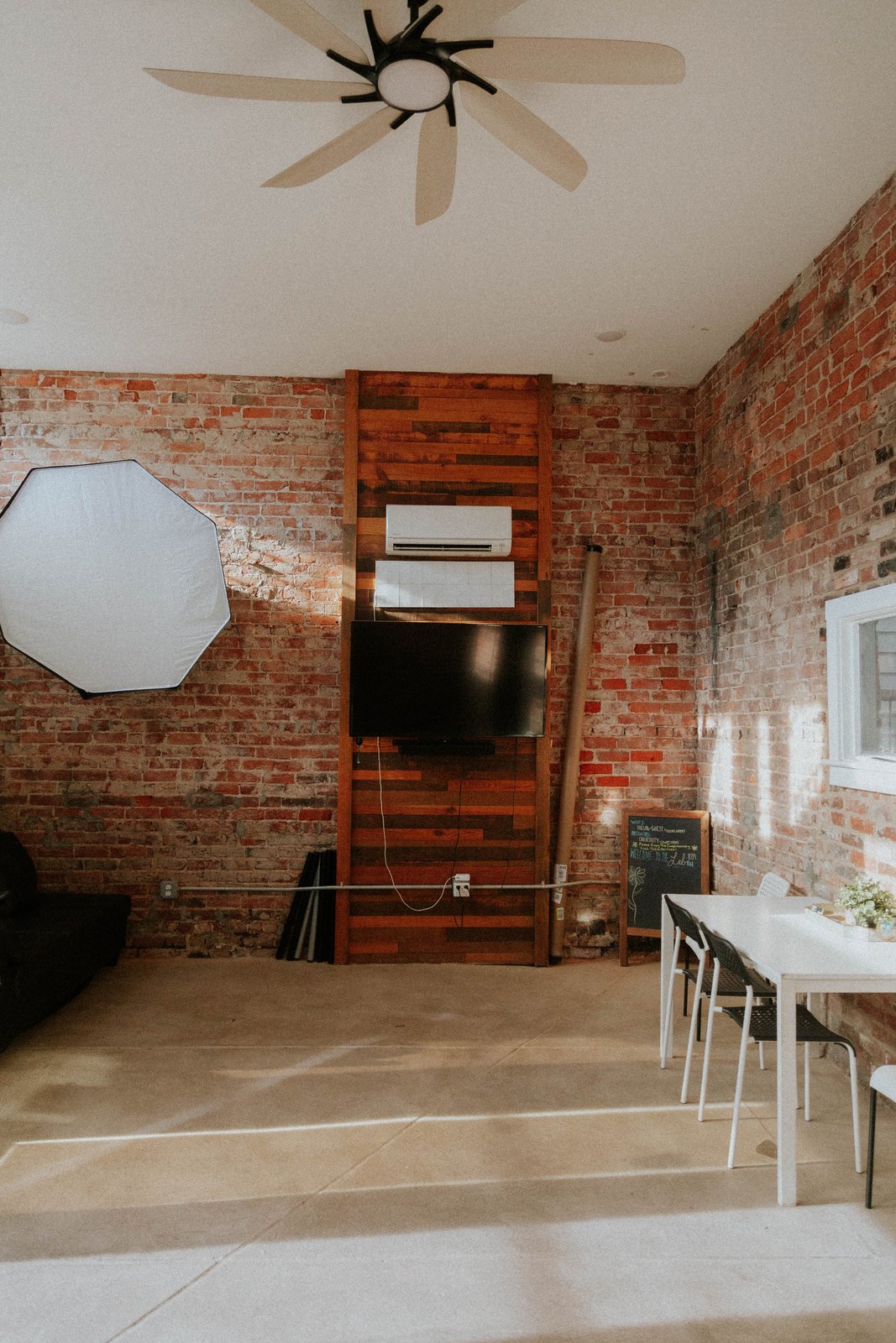 Lounge wall with the wood feature and ceiling fan