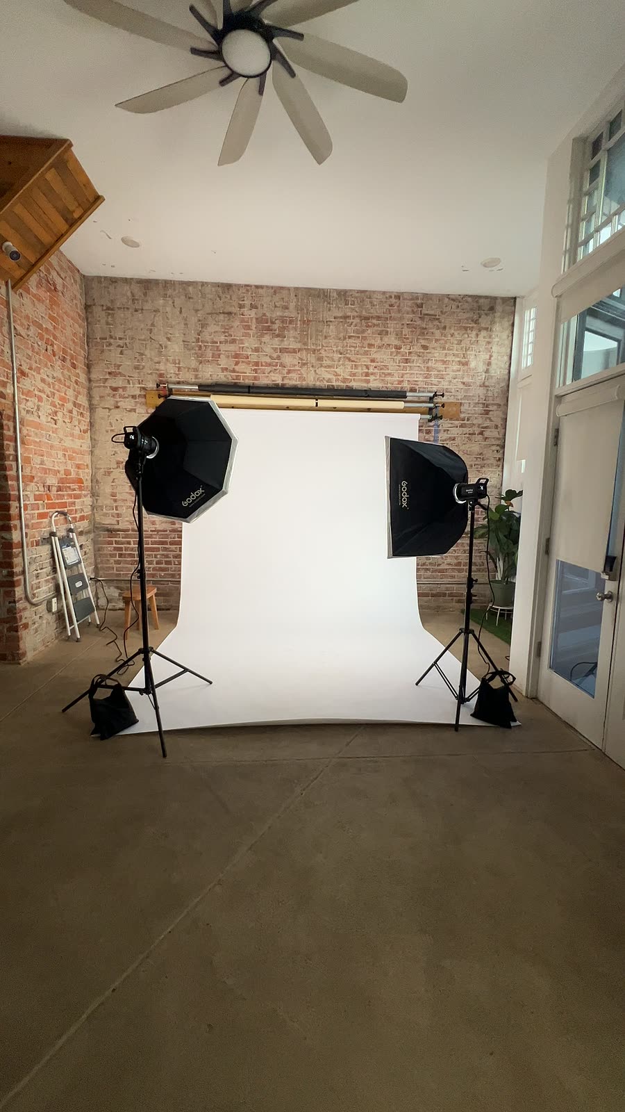 The shoot setup from across the room, under the high ceiling