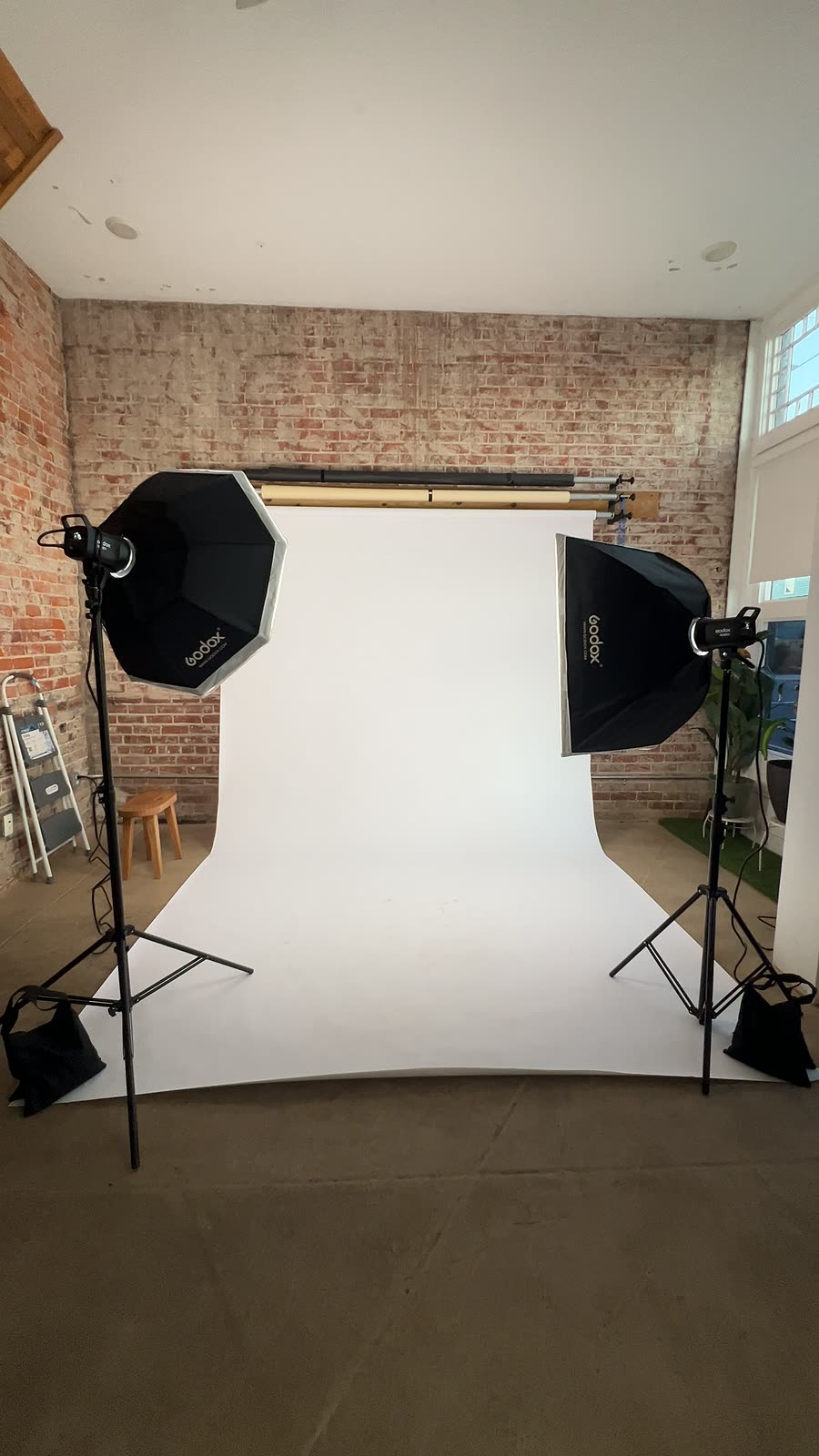 Set for a shoot: white seamless backdrop and two softboxes