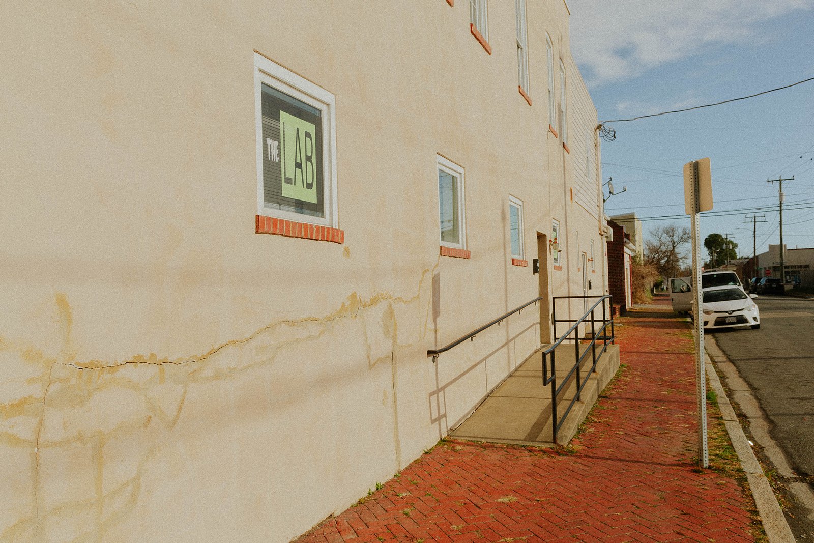 The side of the building and the accessible ramp