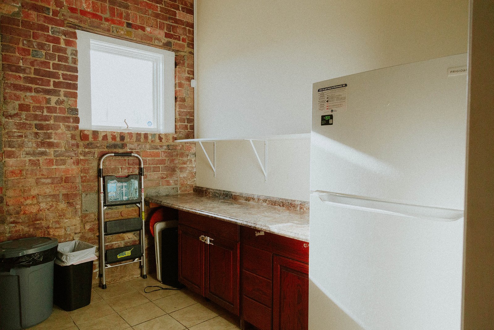 Prep kitchen with full-size refrigerator
